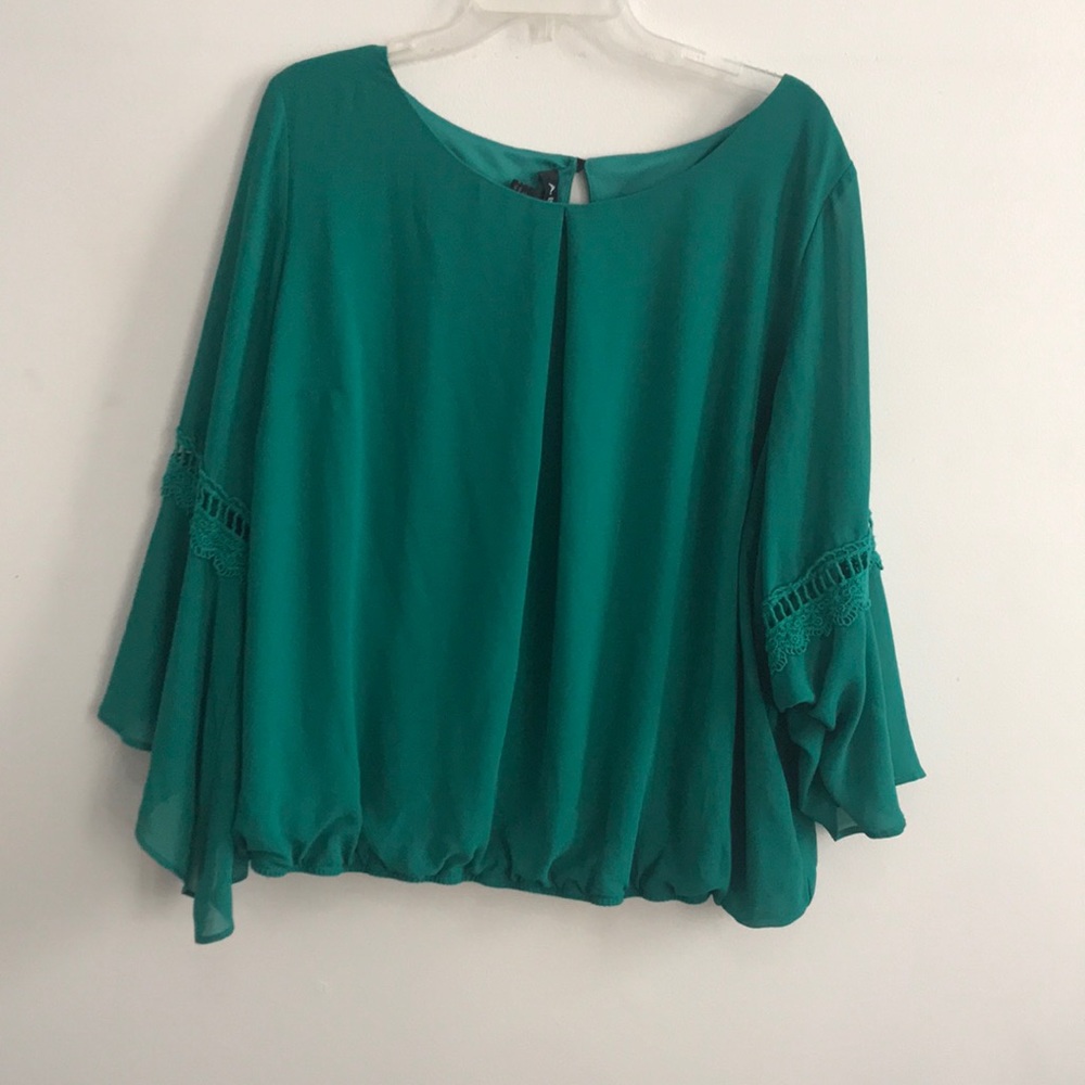 Blouse with embellished sleeves